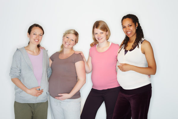 Pregnant friends standing together while isolated on whitehttp://195.154.178.81/DATA/istock_collage/0/shoots/784617.jpg